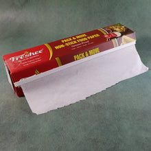 Freshee food paper roll placed beside baking trays for easy access