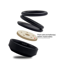 Elegant car air freshener with a unique double-ring design for effective diffusion.