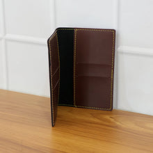 Top view of PU leather card holder highlighting its compact tri-fold design