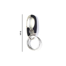 Close-up of locking clip mechanism on stainless steel keychain