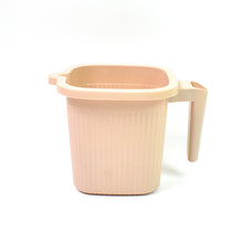 A clean white Plastic Bath Mug, perfect for a modern bathroom aesthetic.