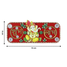 A red rectangular Ganesha Shubh Labh wall decor with white and green embellishments, showing dimensions of 6 cm by 15 cm.