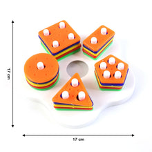 Geometric stacking sorter toy pieces arranged for toddlers’ cognitive learning play