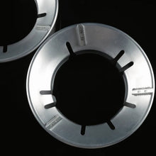 Energy-saving Gas Stove Stand placed on a burner for efficient cooking.