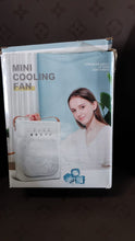 In-use lifestyle shot of portable air cooler fan with LED light