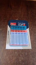 Close-up view of Ritu plastic pouch sealer clips highlighting their design.