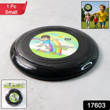 Compact small outdoor frisbee disc thrown in open park space