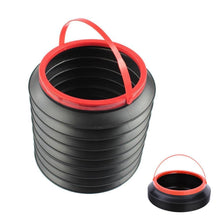 Multipurpose foldable car bin with items like water bottles and tissues inside.