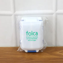 Blue portable pill organizer with secure lids