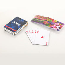 Durable playing cards with a sleek design, perfect for long-lasting use.