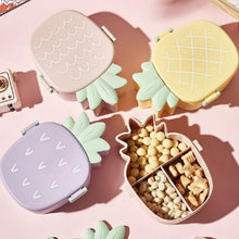 Closed pineapple shaped kids bento lunch box ready for school.