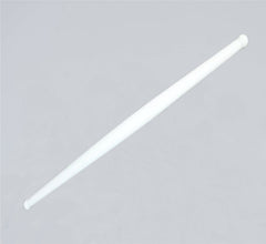 Clean white plastic rolling pin resting on a modern kitchen countertop, ready for use.