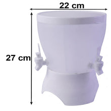 A translucent white plastic dual-compartment beverage dispenser with two white taps and a matching lid is shown with