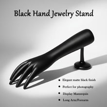 Palm side of black hand-shaped jewelry organizer stand
