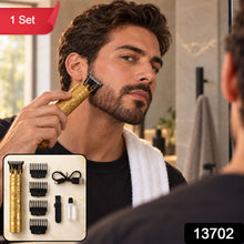A man trims his beard with a gold dragon-detailed hair trimmer, reflected in a mirror, with the entire grooming set in a