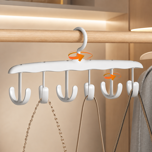 White plastic hanger with six rotating hooks, holding two bags on a wooden closet rod.