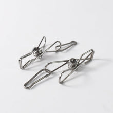 Durable stainless steel clothes pegs holding clothes securely