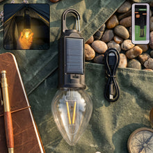 Carabiner clip attached to solar camping lantern for hanging