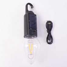 Close-up of vintage warm LED filament bulb in camping lantern
