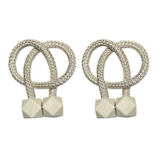 Modern magnetic curtain rope tiebacks providing a chic touch to home decor.