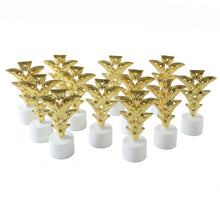 A group of twelve golden Christmas tree LED tealight candles are arranged neatly on a plain white surface.