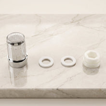 Faucet adapter fitted to a kitchen sink tap