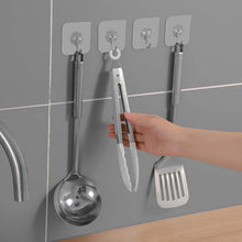 Wall hooks being used to hang items in home