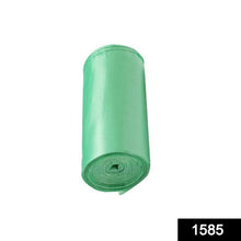 Stack of green eco-friendly garbage bag rolls for daily waste management.