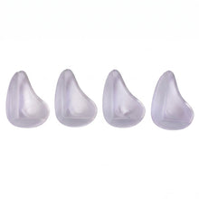 Four clear, rounded silicone corner protectors are arranged in a row against a plain white background.