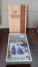 Decorative wooden wall panel with hooks, showing intricate vertical scenery.