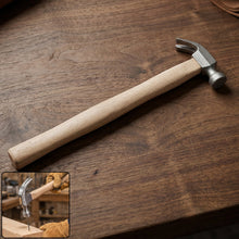 Wooden handle claw hammer with steel head for carpentry and DIY projects