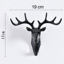 Stylish deer head hook in grey, functioning as a decorative hanger for a hat.