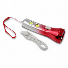 A red and silver torchlight with a red lanyard and a coiled white USB cable on a white surface.
