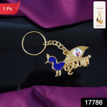 Close-up of Krishna enamel peacock design on metal keyring