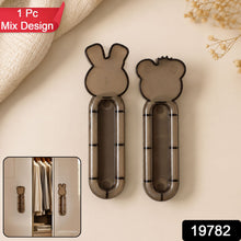 Close up of self stick push pull helper for furniture without drilling