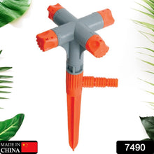 Top-down view of the 4-arm adjustable garden sprinkler, showing its rotating mechanism.