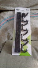 Eco-friendly adhesive and mounting accessories for the GlimmerHome coat hanger.