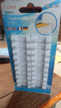 A close-up view of the round sticky cable clips, highlighting their strong adhesive backing.