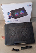 Detail shot of the integrated phone holder on the side of the laptop cooling pad.