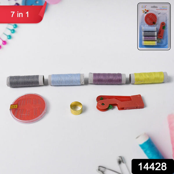 A 7-in-1 sewing kit with four spools of thread, a needle disc, thimble, and needle threader on a white surface.