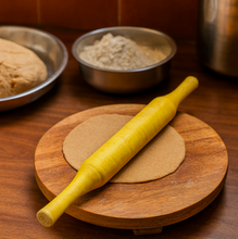Side view of the ergonomic wooden Bombay belan, a comfortable kitchen tool.