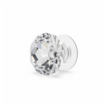 Diamond crystal pull handle enhancing a white cupboard door, adding a touch of glamour.
