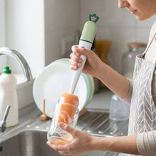Using the brush for bottle cleaning in kitchen