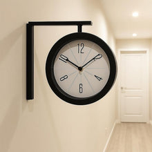 Railway station clock mounted in hallway