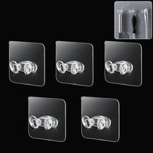 Set of five durable adhesive plastic wall hooks for home organization