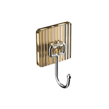 Metal wall hook with decorative base for stylish storage