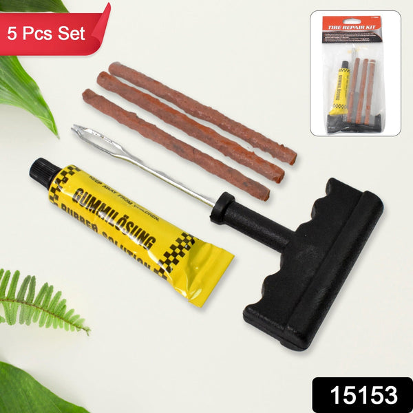 A 5-piece tire repair kit, including a yellow rubber solution tube, three brown repair strips, and a black T-handle tool,