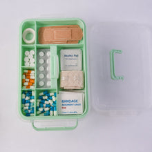 Interior view of first aid box with compartments for medical supplies