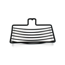 Wall mount soap rack holding a bar of soap, demonstrating its secure grip and drainage.