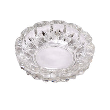 Versatile glass ashtray with multiple slots, suitable for both cigars and cigarettes.